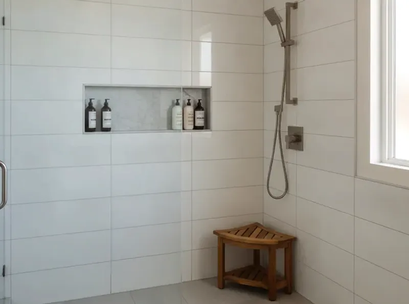 A walk-in shower tiled in San Diego, with frameless glass and brushed-nickel fixtures as part of the remodel